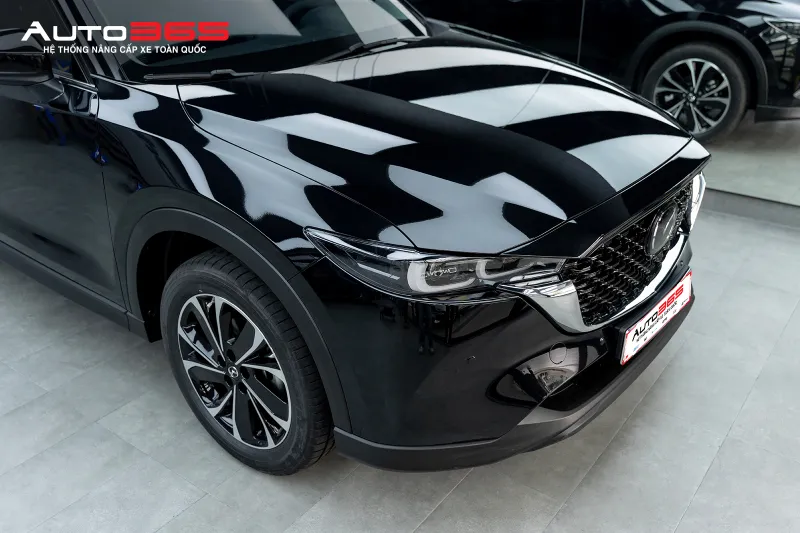 Bề mặt phần đầu Mazda CX-5 sau khi hoàn thiện PPF 3M 50 Gloss; ảnh ghi nhận ngoại quan tổng thể sau thi công, không dùng riêng để kết luận một vết xước cụ thể đã được PPF che hoặc loại bỏ