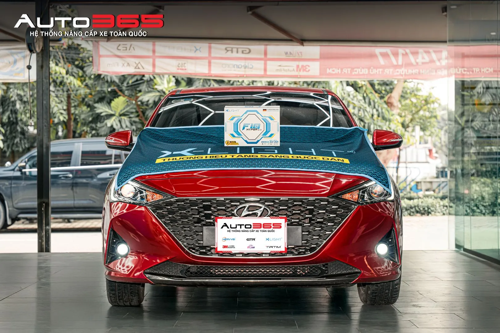 Hyundai Accent màu đỏ sau khi hoàn thiện hạng mục đèn gầm tại Auto365.vn - Trụ Sở Chính.